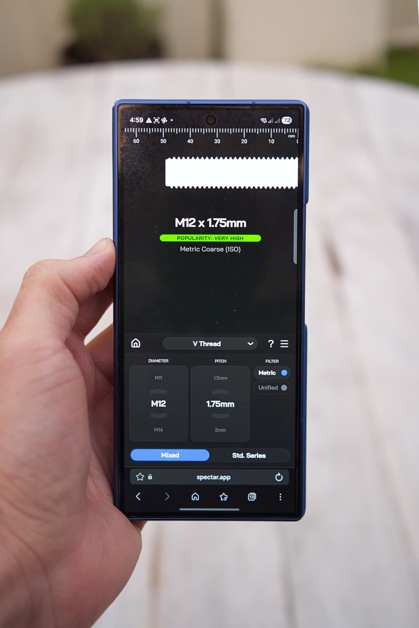 Photo of Spectar app on a phone with an M12 x 1.25 hex head bolt positioned perfectly over a matching silhouette